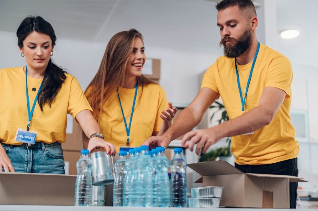 Group of volunteers working in community charity donation center